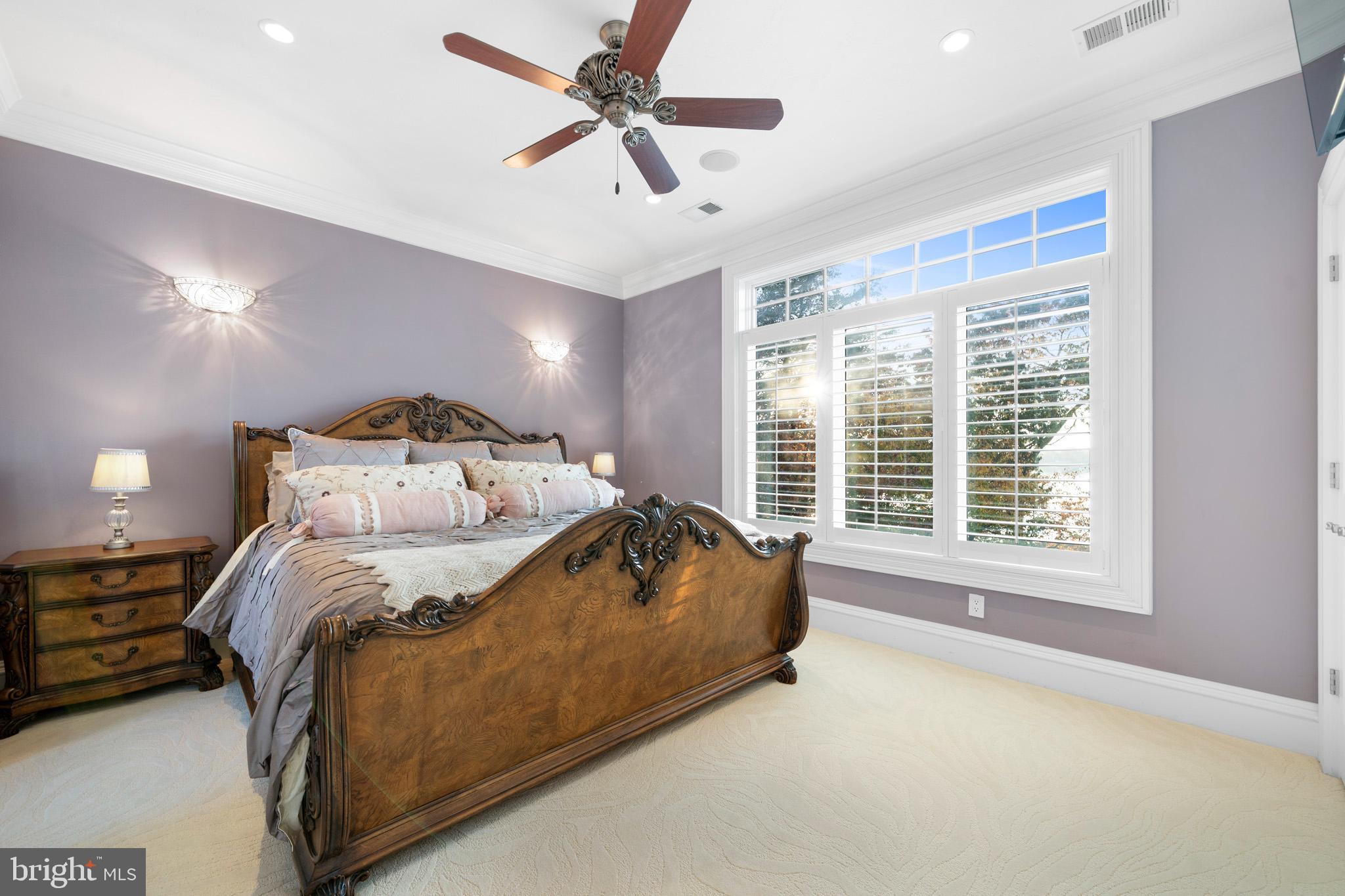 206 Harbor Drive Lusby, MD 20657 - Photo 64 of 109 a spacious bedroom with a bed and a large window