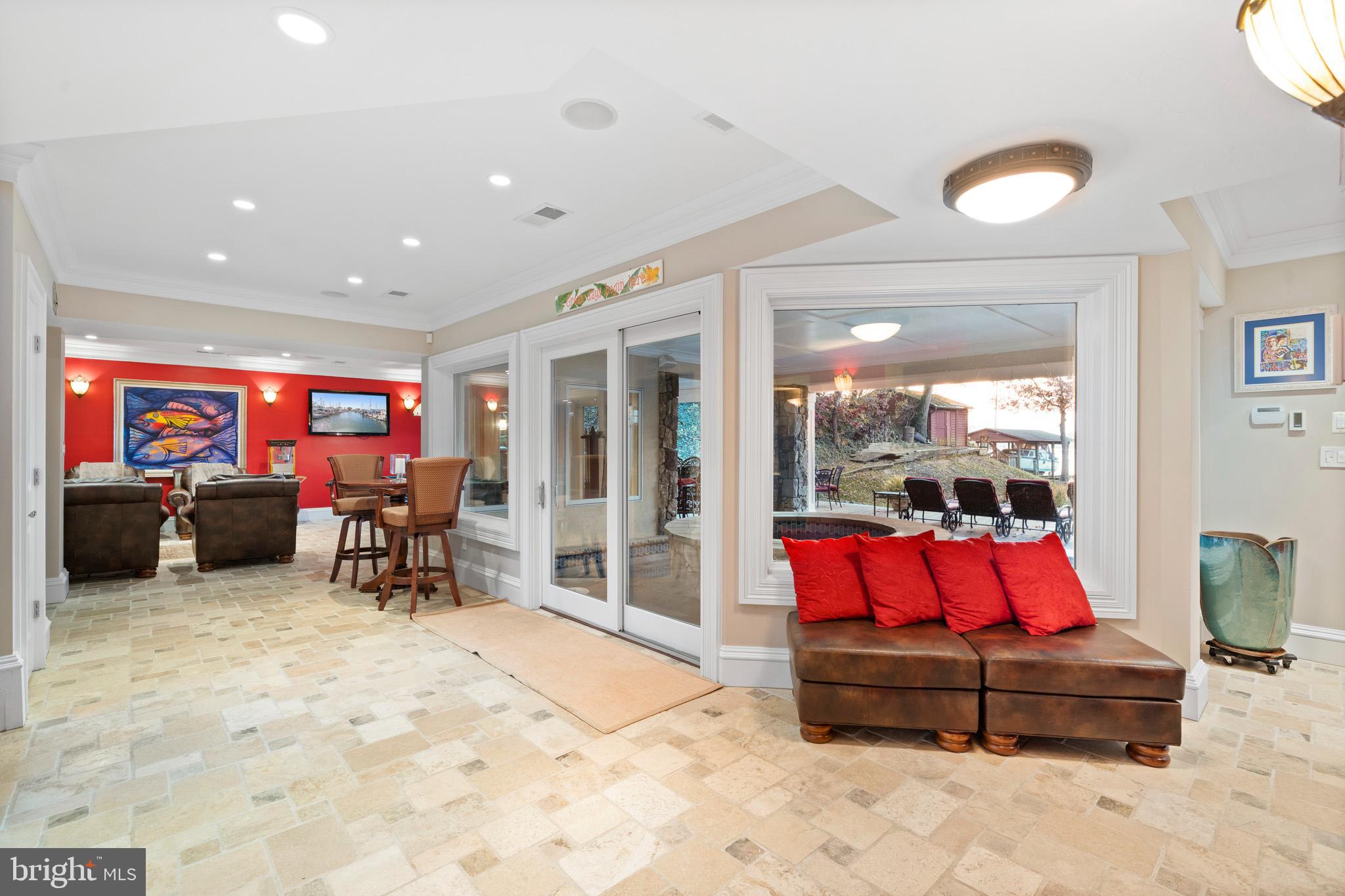 206 Harbor Drive Lusby, MD 20657 - Photo 67 of 109 a living room with furniture a flat screen tv and a large window