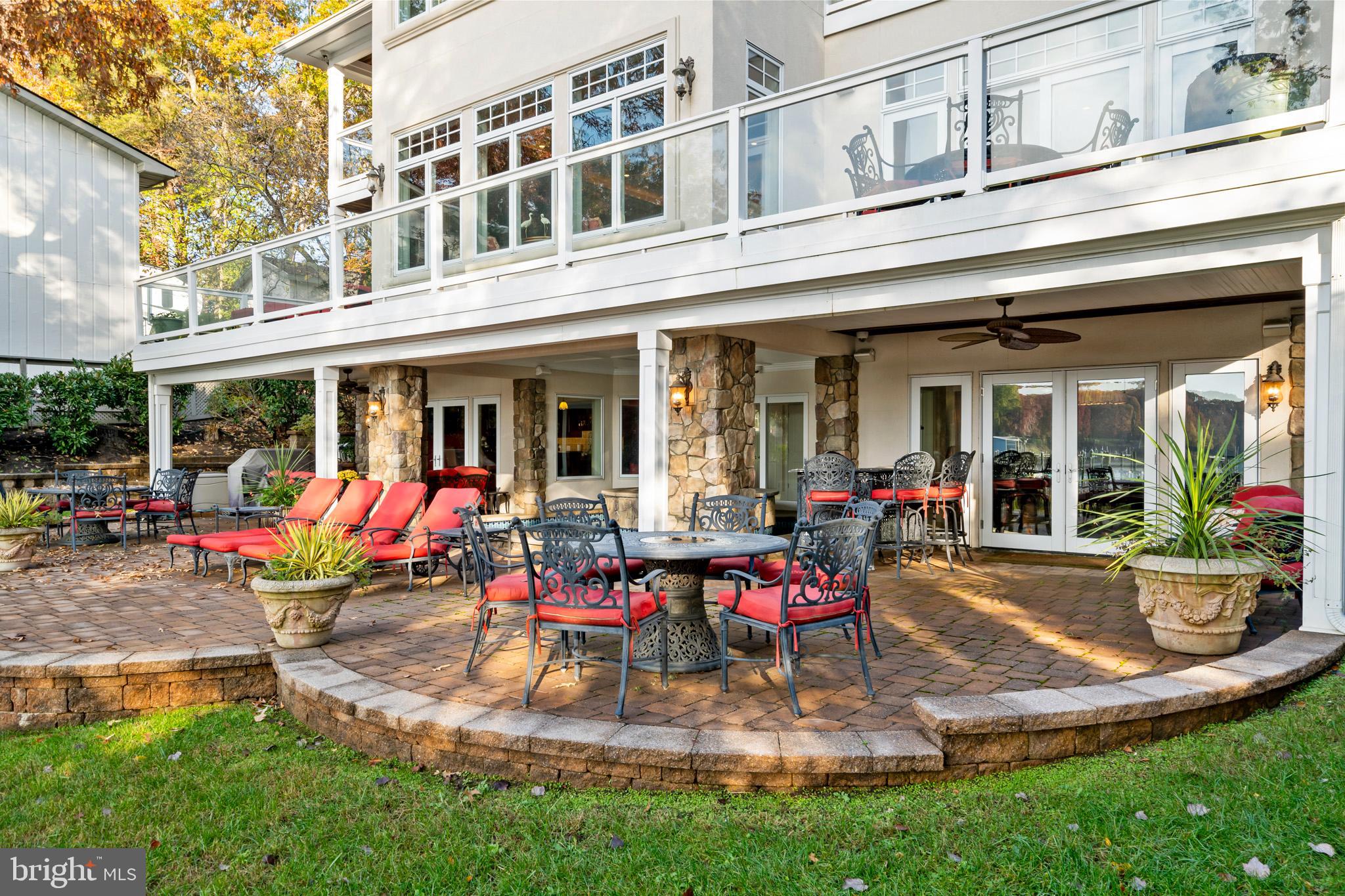 206 Harbor Drive Lusby, MD 20657 - Photo 88 of 109 a view of a house with a patio chairs and dinning table and chairs