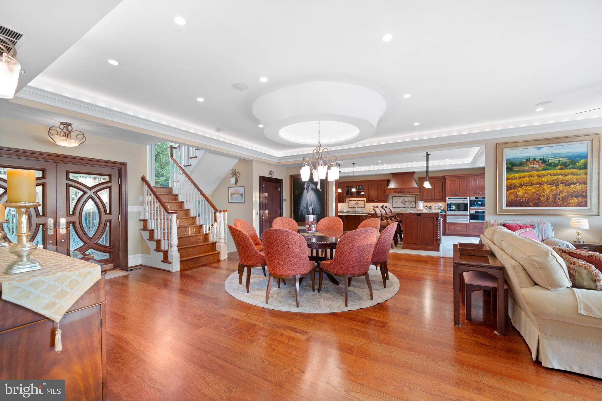 206 Harbor Drive Lusby, MD 20657 - Photo 9 of 109 a view of a dining room with furniture one side kitchen view and wooden floor