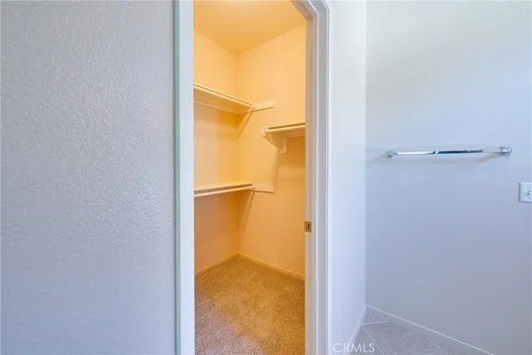 a spacious bathroom with a double vanity sink a mirror and a shower