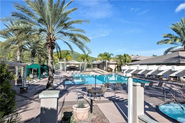 a view of a patio with swimming pool