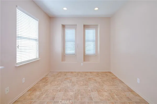 a large kitchen with stainless steel appliances granite countertop a stove a sink and a refrigerator