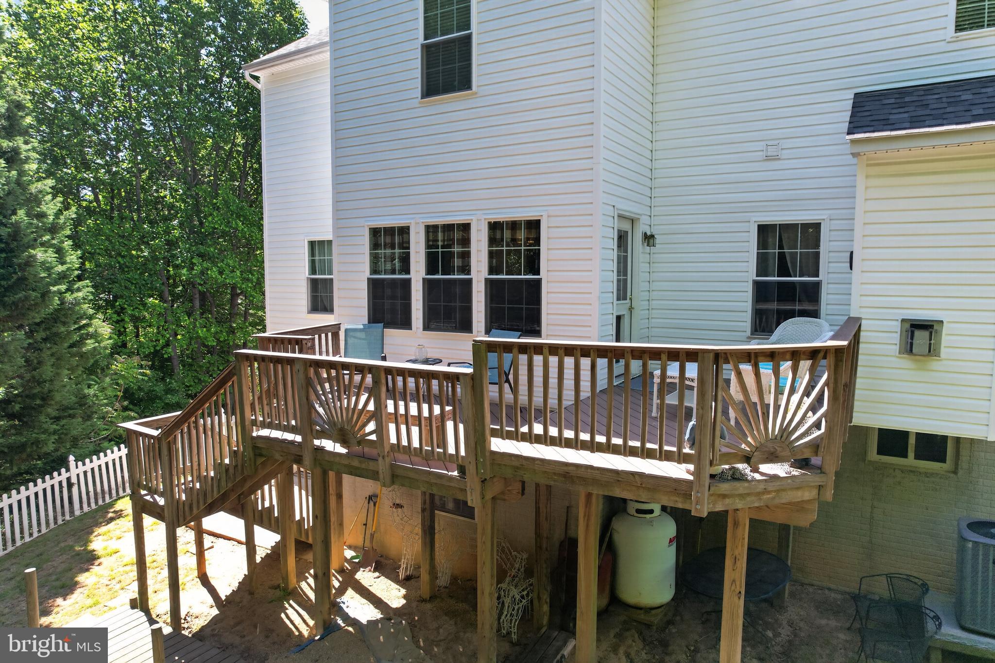 1810 Rudolph Lane Lusby, MD 20657 - Photo 33 of 40 Back side- view of deck and windows