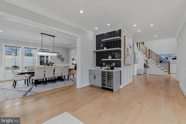 a kitchen with lots of counter top space a sink appliances and cabinets
