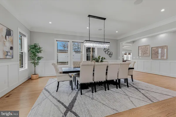 a kitchen with stainless steel appliances a stove a sink a refrigerator and cabinets