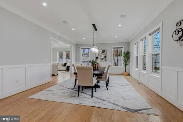 a kitchen with a dining table and chairs