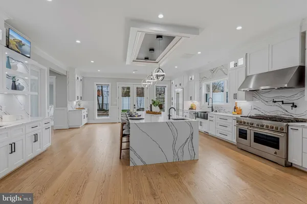 a living room with furniture and kitchen view
