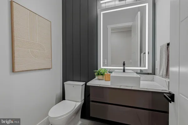 a view of an entryway with wooden floor and a front door