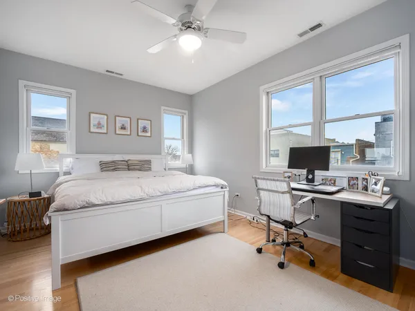 a bedroom with a workspace