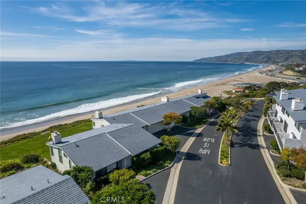 a view of a yard and ocean view