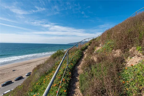 a view of a swimming pool with a yard