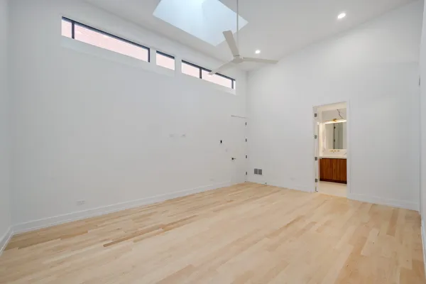 a bedroom with a bed and a television