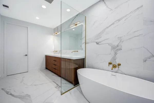 a bathroom with a bathtub and a shower