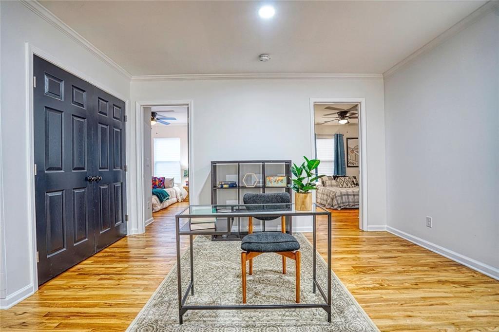 2230 Beecher Circle Southwest Atlanta, GA 30311 - Photo 14 of 29 a workspace room with furniture and wooden floor