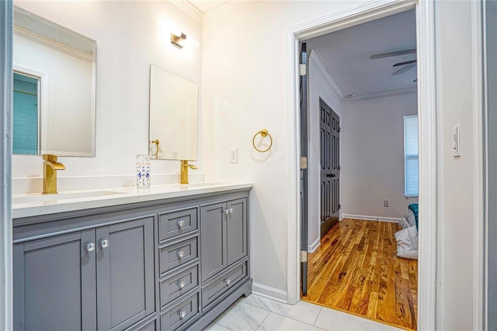 2230 Beecher Circle Southwest Atlanta, GA 30311 - Photo 16 of 29 a bathroom with a sink and a mirror