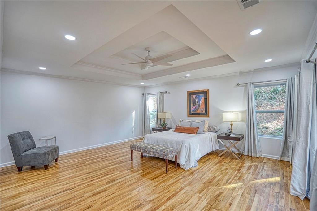 2230 Beecher Circle Southwest Atlanta, GA 30311 - Photo 21 of 29 a bedroom with a bed and wooden floor
