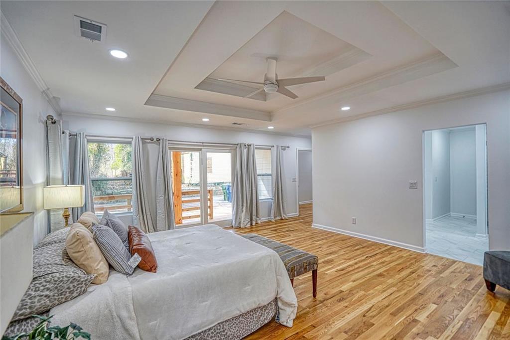 2230 Beecher Circle Southwest Atlanta, GA 30311 - Photo 22 of 29 a bedroom with a large bed couch and a window