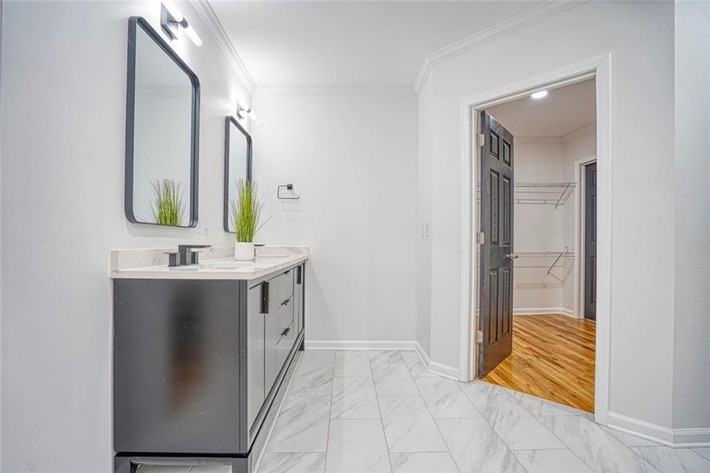 2230 Beecher Circle Southwest Atlanta, GA 30311 - Photo 23 of 29 a bathroom with a double vanity sink and mirror