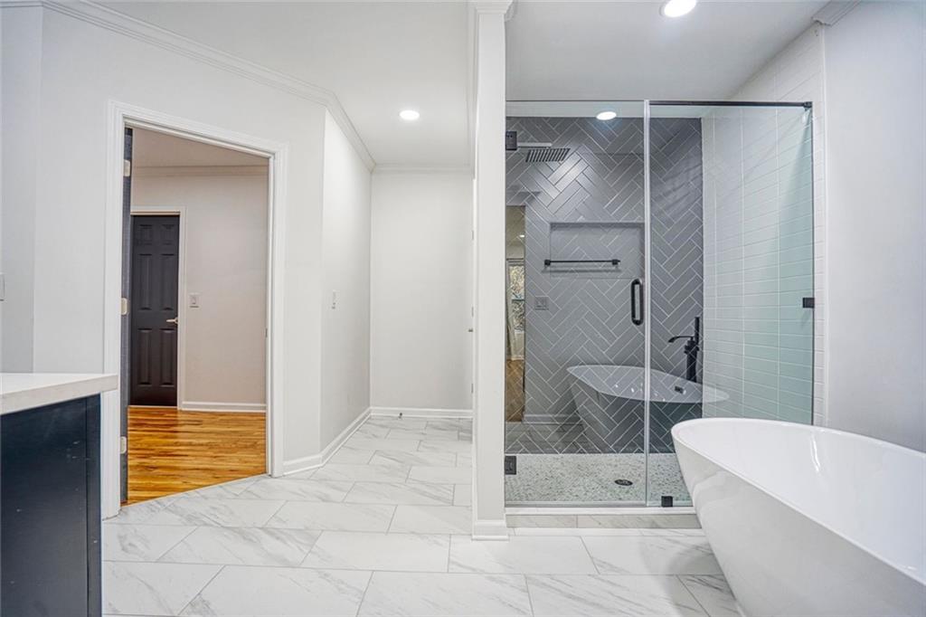 2230 Beecher Circle Southwest Atlanta, GA 30311 - Photo 24 of 29 a bathroom with a bathtub and a shower