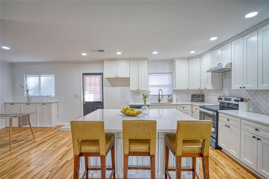 2230 Beecher Circle Southwest Atlanta, GA 30311 - Photo 7 of 29 a kitchen with a dining table chairs and view kitchen