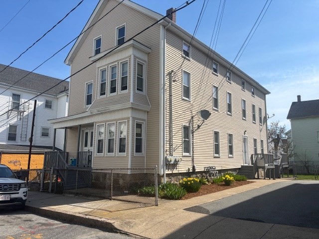 380 5th Street Fall River, MA 02721 - Photo 1 of 2 a view of a white building among the street with palm trees
