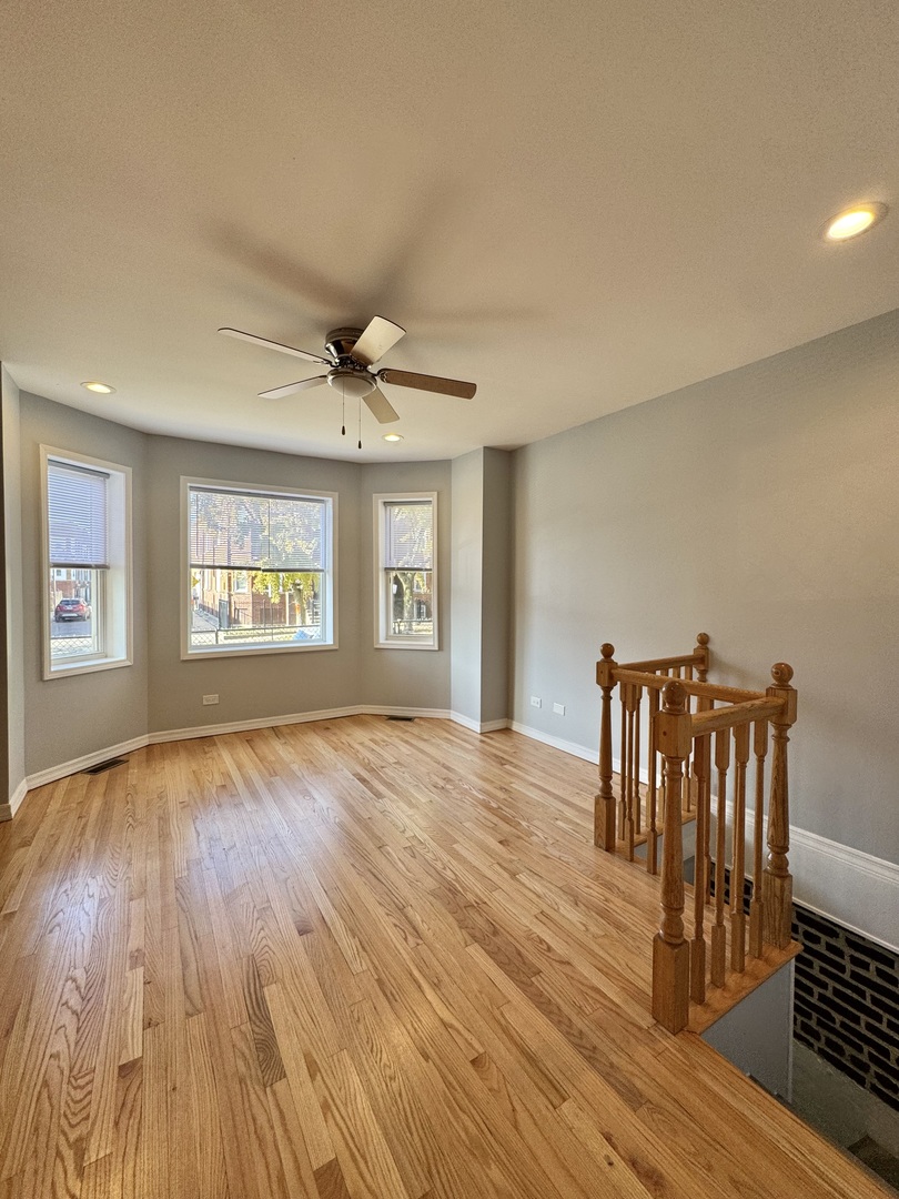 1263 North Springfield Avenue, Unit 1 Chicago, IL 60651 - Photo 3 of 9 a view of livingroom with furniture and wooden floor
