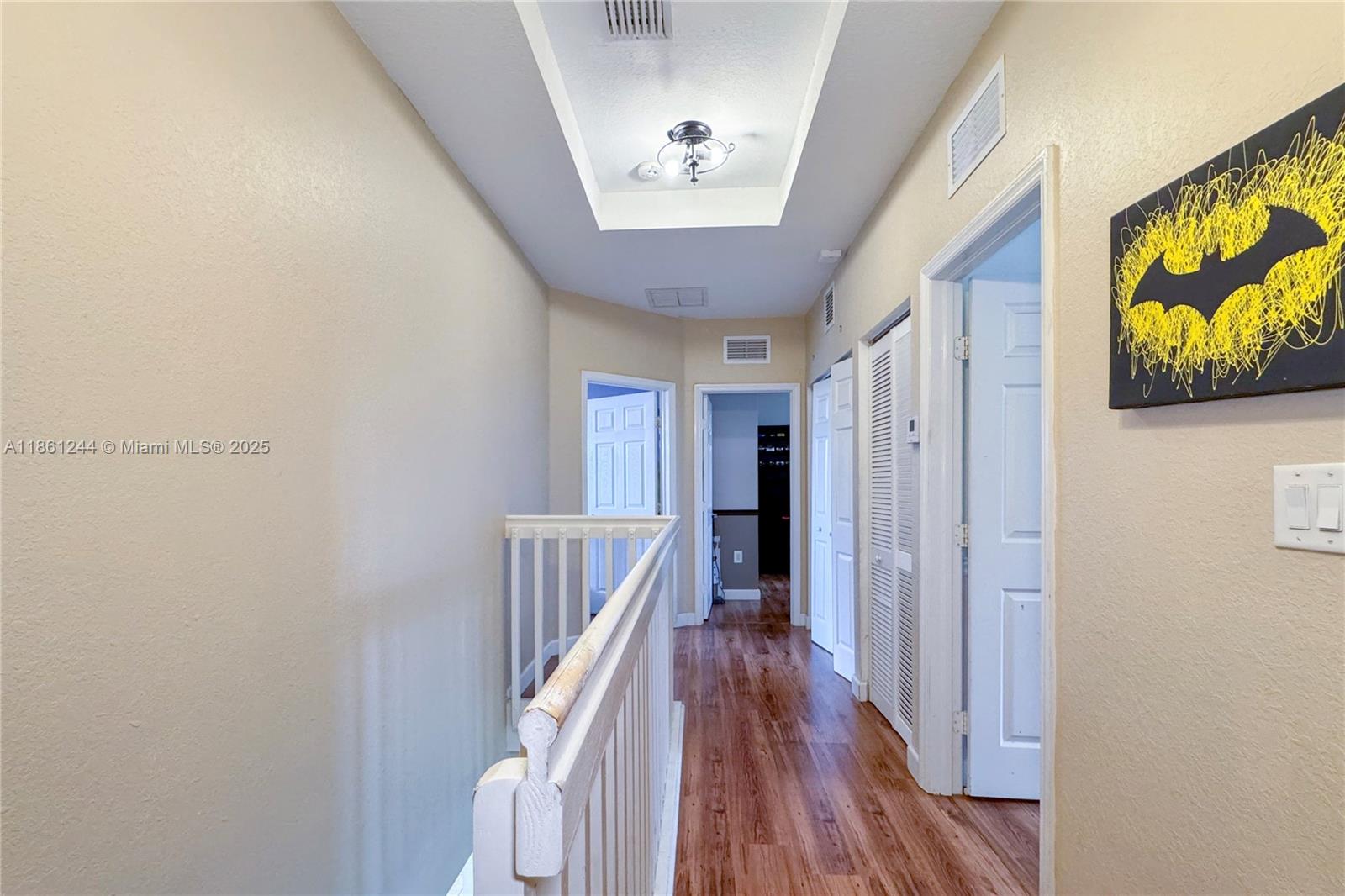 23745 Southwest 114 Court Homestead, FL 33032 - Photo 17 of 30 a view of a hallway with wooden floor and staircase