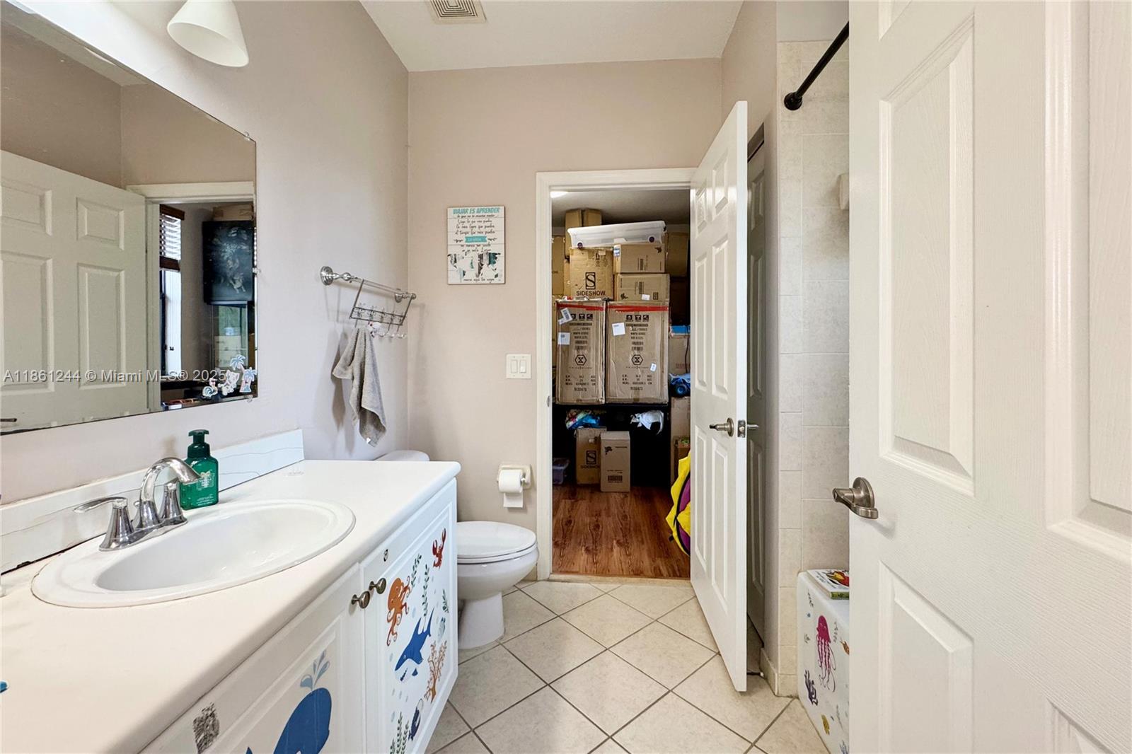 23745 Southwest 114 Court Homestead, FL 33032 - Photo 21 of 30 a bathroom with a sink and a mirror