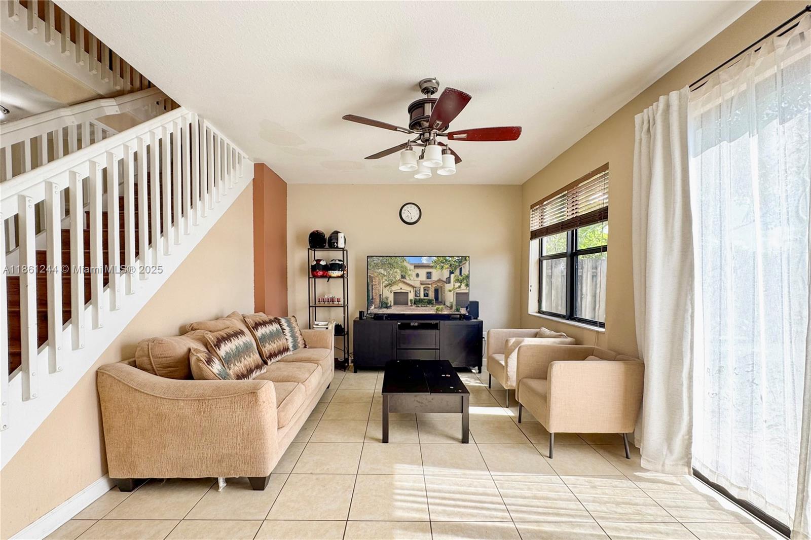 23745 Southwest 114 Court Homestead, FL 33032 - Photo 7 of 30 a living room with furniture and a large window