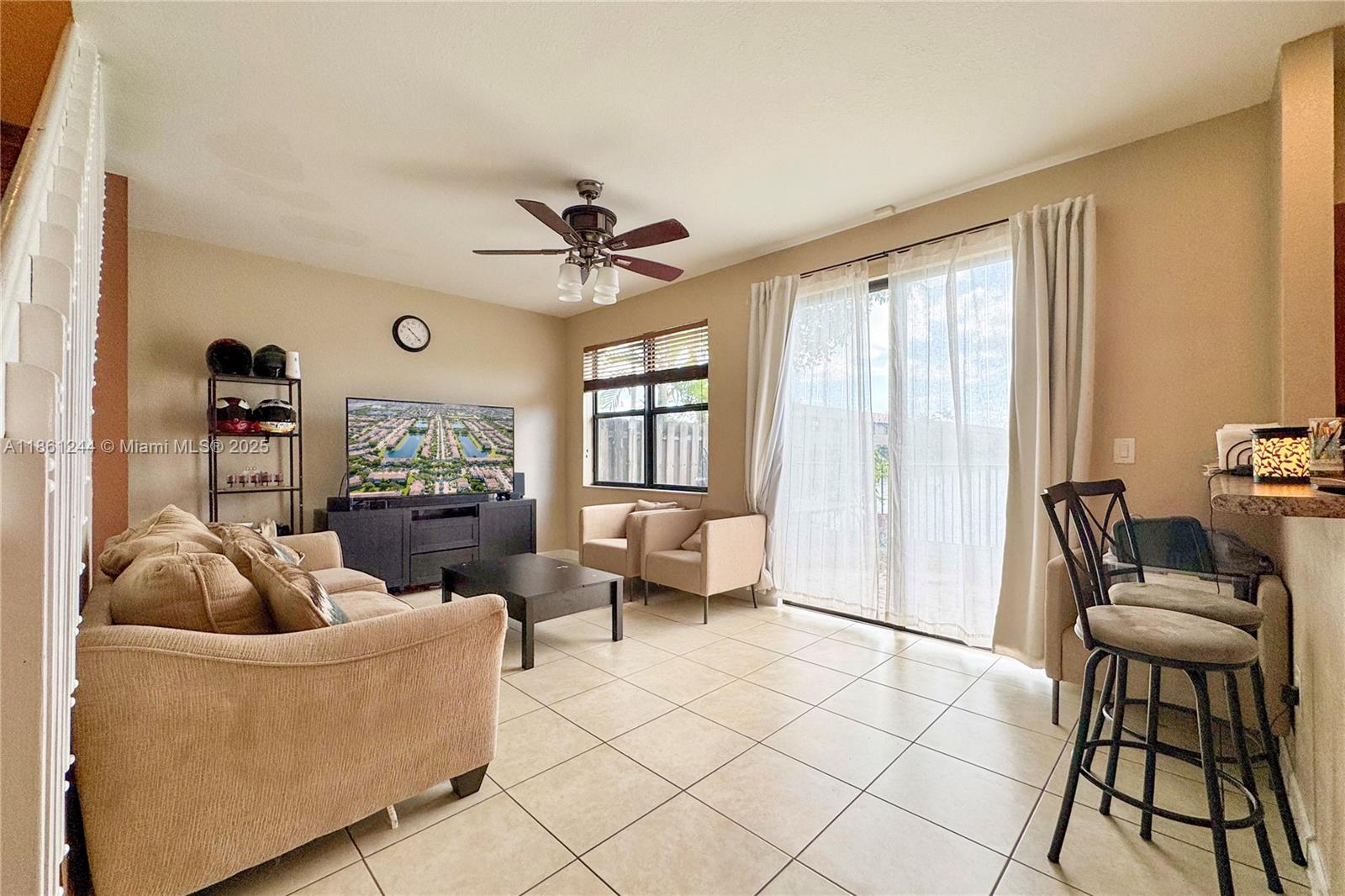 23745 Southwest 114 Court Homestead, FL 33032 - Photo 8 of 30 a living room with furniture and a large window