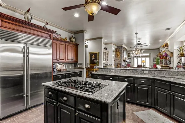 a kitchen with a stove a sink and a refrigerator