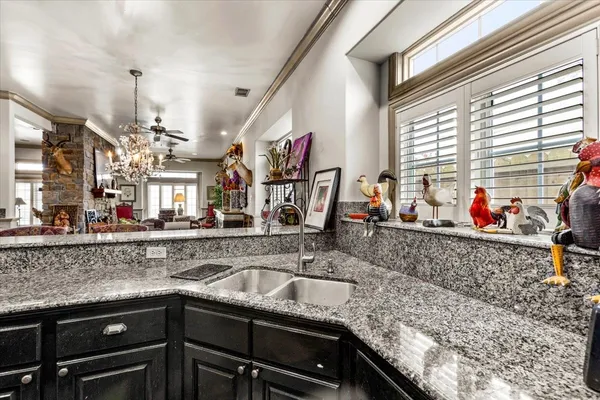 a kitchen with a sink and a counter top space