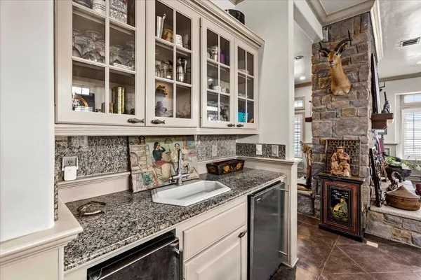 a kitchen with a stove and a sink