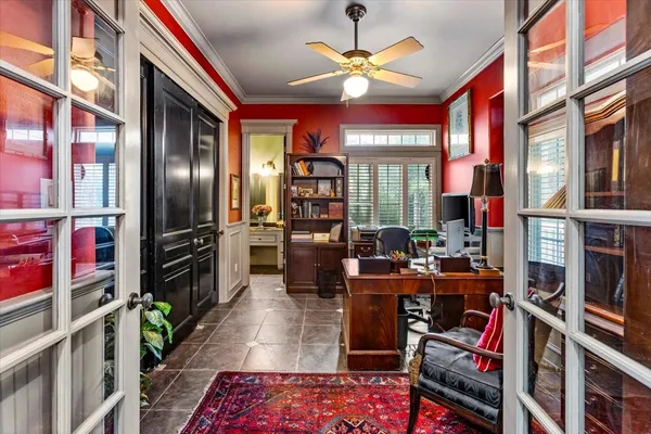 a living room with furniture a rug and a book shelf