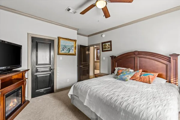 a bedroom with a bed and a television in it