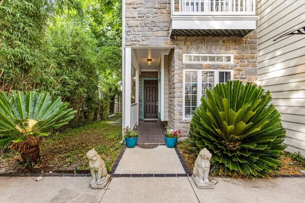 a view of a potted plants in front of a house
