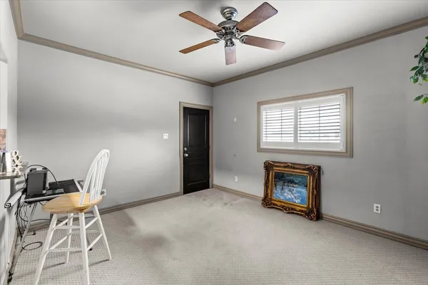 a living room with furniture a fireplace and a window
