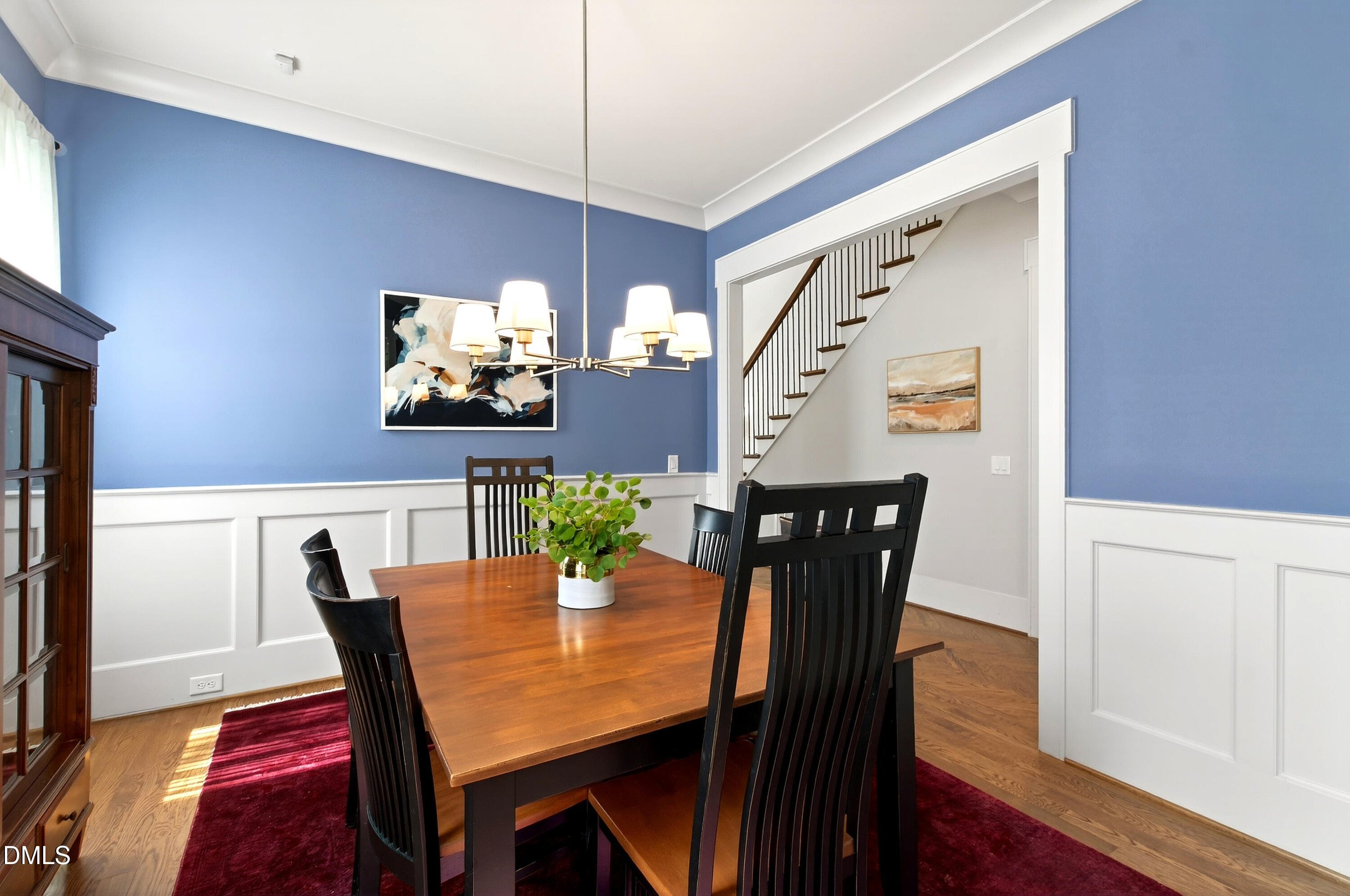 1116 Hymettus Court Raleigh, NC 27607 - Photo 12 of 69 a view of a dining room with furniture and wooden floor