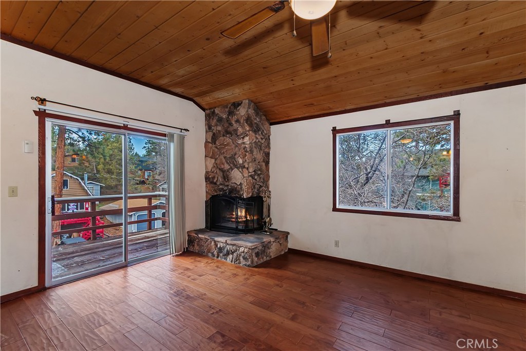 245 Vista Sugarloaf, CA 92386 - Photo 15 of 50 a living room with furniture and a floor to ceiling window