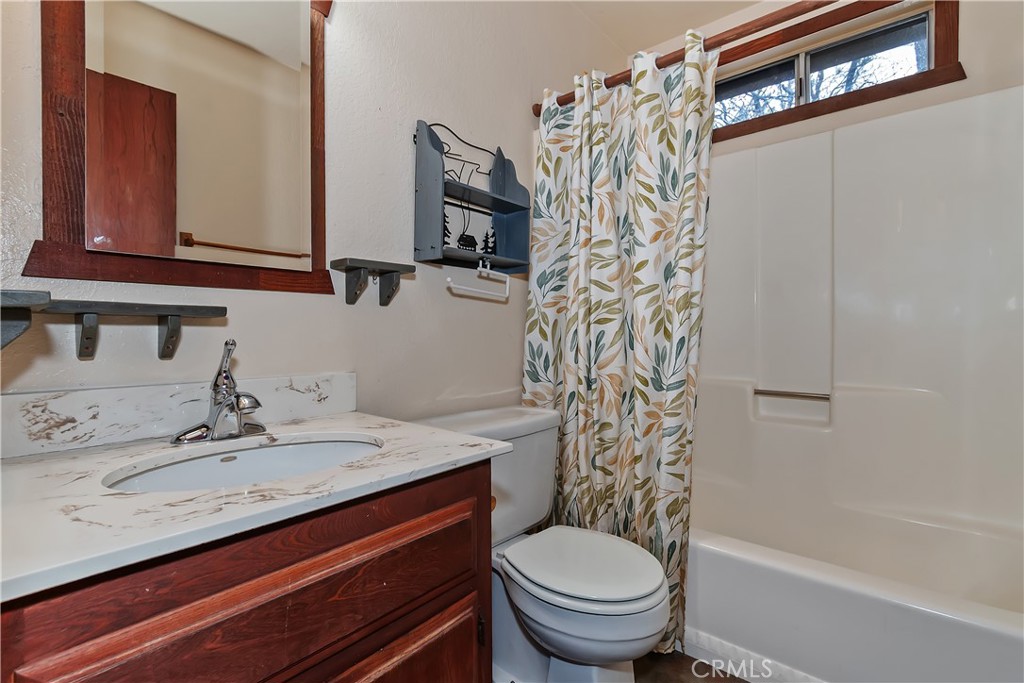 245 Vista Sugarloaf, CA 92386 - Photo 25 of 50 a bathroom with a sink a toilet and shower