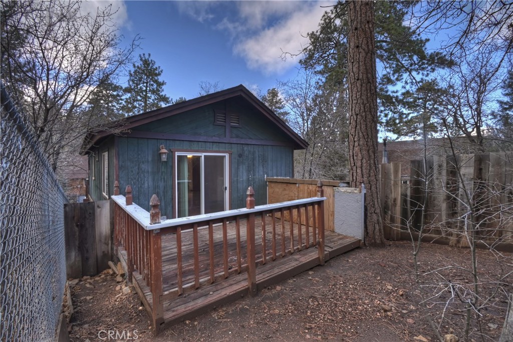 245 Vista Sugarloaf, CA 92386 - Photo 37 of 50 a view of a house with wooden fence and large trees