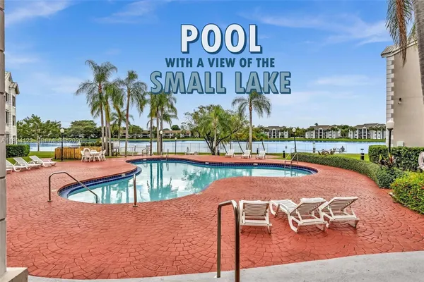 a view of outdoor space with swimming pool and seating