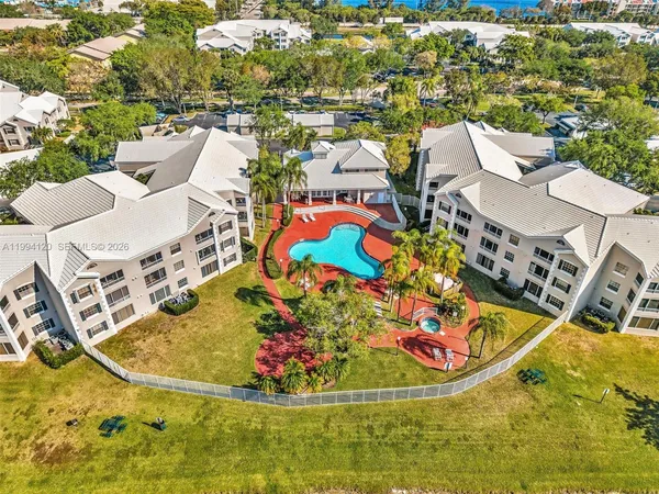 a view of a swimming pool with outdoor seating