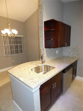a kitchen with a sink and a microwave