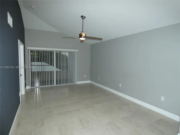 a view of an empty room with a window