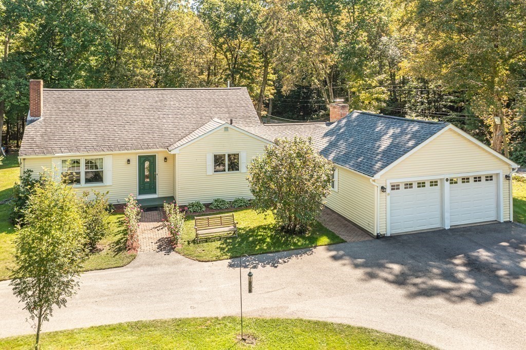 215 Stafford Road Holland, MA 01521 - Photo 2 of 36 a house view with a garden space