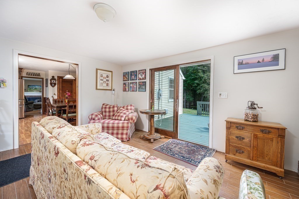215 Stafford Road Holland, MA 01521 - Photo 22 of 36 a bedroom with a bed and a dresser next to a window