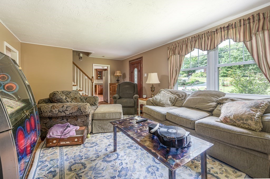 215 Stafford Road Holland, MA 01521 - Photo 24 of 36 a living room with furniture and a large window