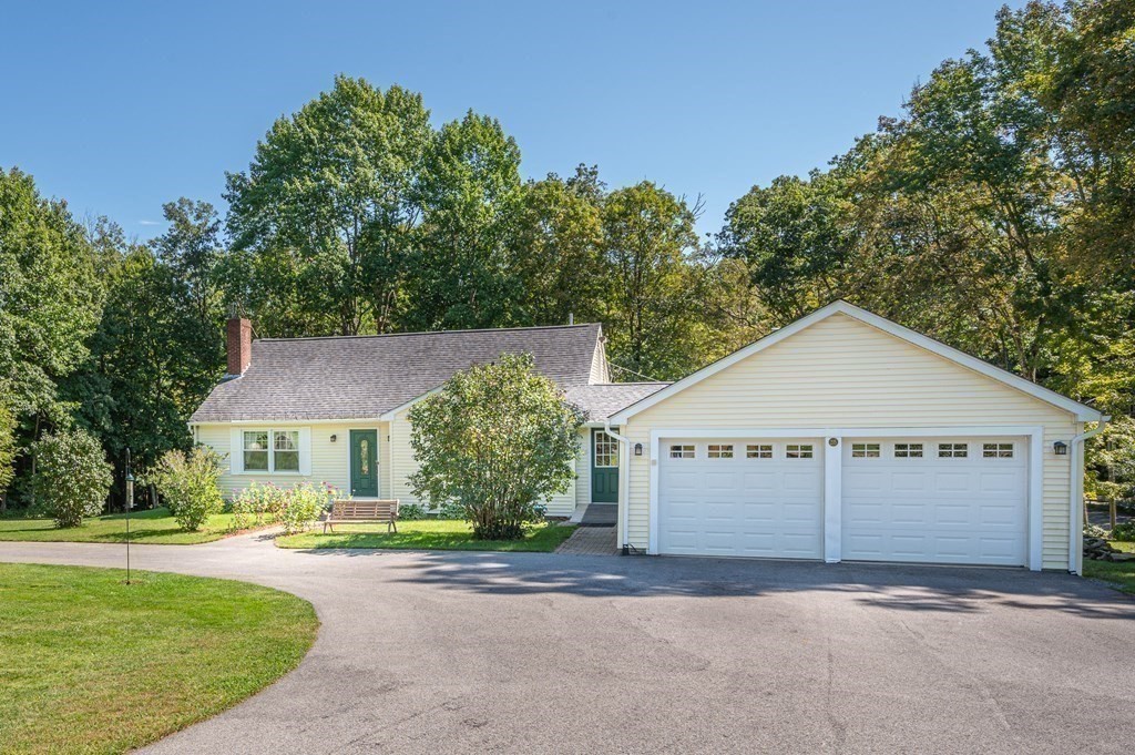 215 Stafford Road Holland, MA 01521 - Photo 4 of 36 a front view of a house with a yard and garage